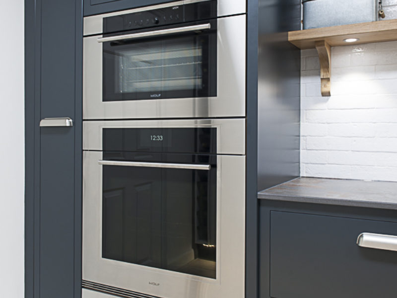 dark grey minimal kitchen with oven