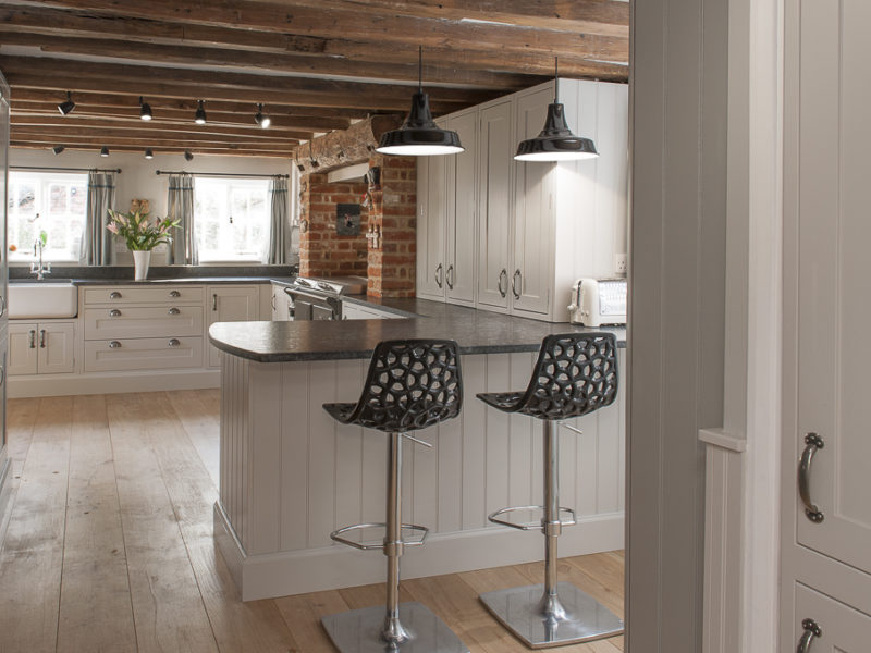 cottage kitchen with industrial metal barstools