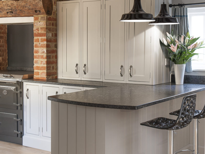 breakfast bar with beams and metal barstools