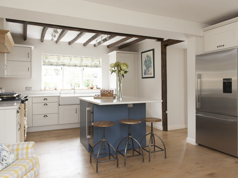 cottage kitchen with beams and wood floor