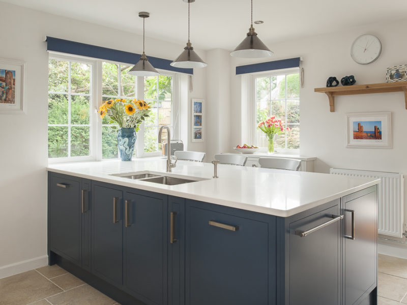 blue kitchen island with french windows