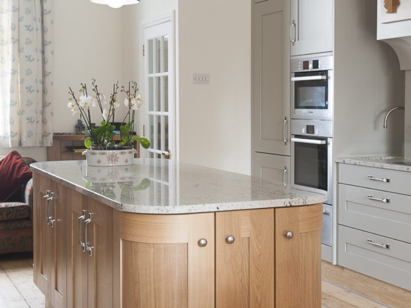 wood kitchen island with pendant lamps