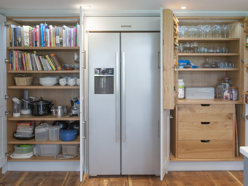 farmhouse kitchen with wood floor and shelving