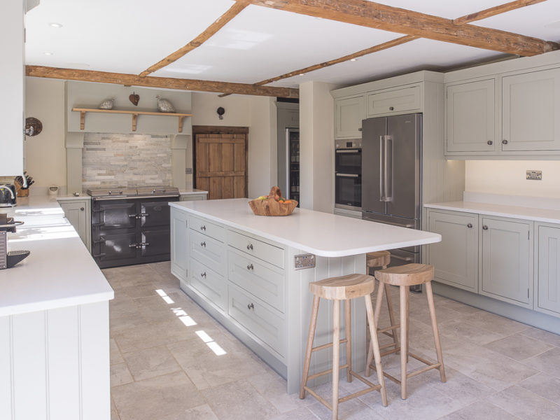 functional kitchen with tiled floor and island