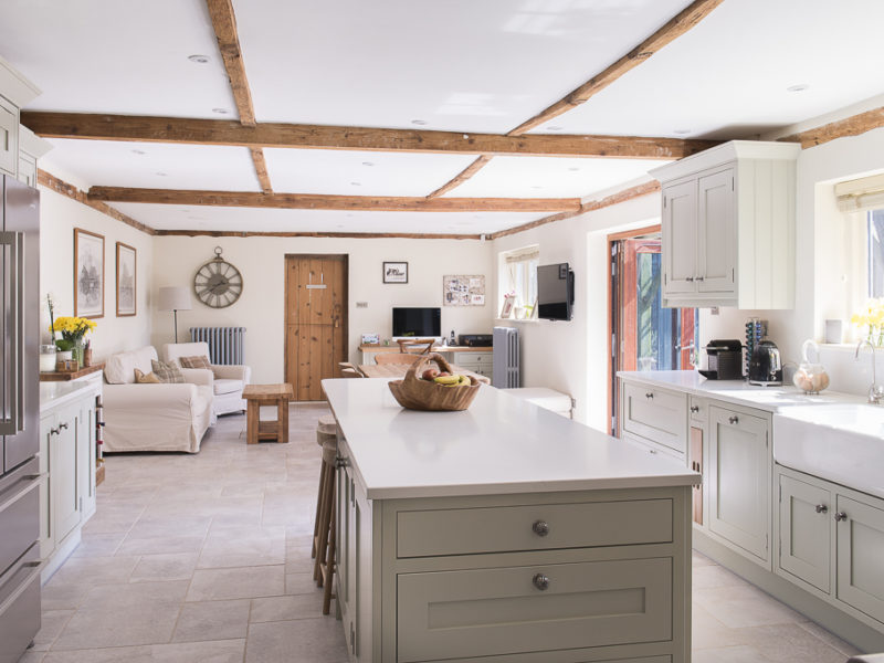 stylish kitchen with wood accents and tiled floor