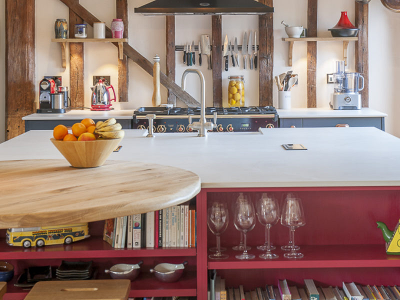 barn kitchen with pendant lights and barstool