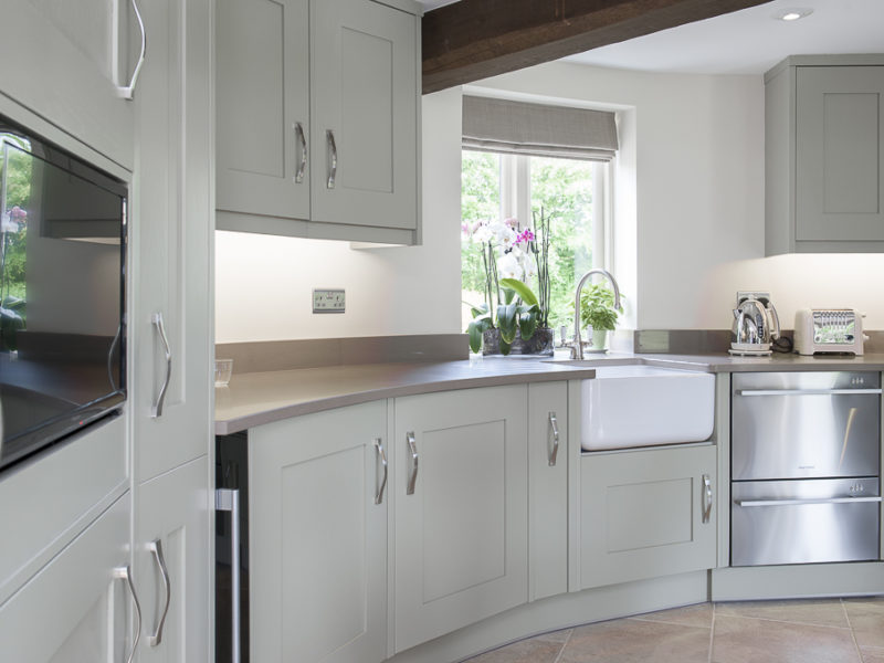 unusual grey round kitchen with belfast sink